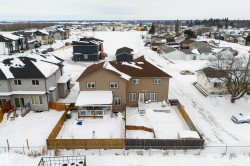 Snowy aerial view featuring a residential view - 