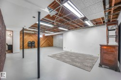 Finished below grade area featuring wood walls - 