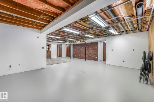Finished below grade area with brick wall - 760 Knottwood Road S, Edmonton, AB - Indoor Photo Showing Basement