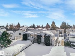 View of front of property featuring a gate and a residential view - 