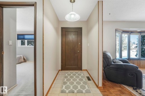 Tiled entrance foyer featuring a textured ceiling - 760 Knottwood Road S, Edmonton, AB - Indoor Photo Showing Other Room
