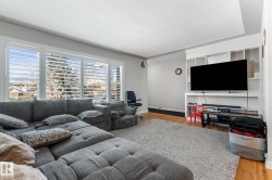 Living area featuring wood finished floors and baseboards - 