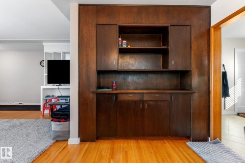 Detailed view of wood finished floors - 9847 79 Street, Edmonton, AB - Indoor Photo Showing Other Room