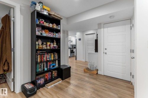 Sitting room featuring light wood-style flooring - 9847 79 Street, Edmonton, AB - Indoor Photo Showing Other Room