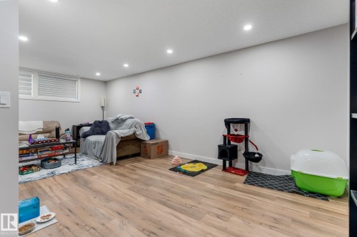 Playroom featuring recessed lighting and wood finished floors - 9847 79 Street, Edmonton, AB - Indoor