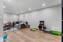 Playroom featuring recessed lighting and wood finished floors - 