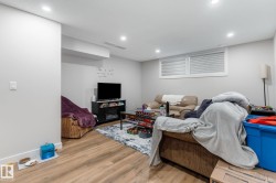 Living room featuring light wood-style floors and recessed lighting - 
