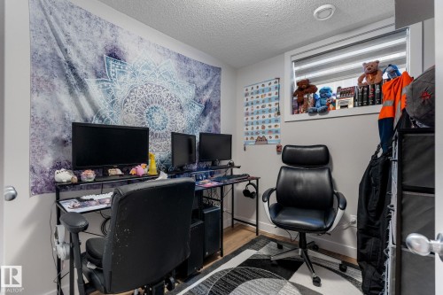 Office featuring a textured ceiling and wood finished floors - 9847 79 Street, Edmonton, AB - Indoor Photo Showing Office
