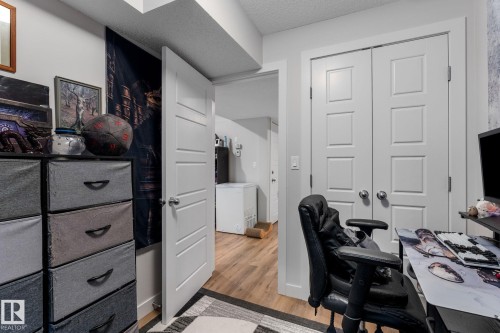 Home office with light wood-style floors and a textured ceiling - 9847 79 Street, Edmonton, AB - Indoor Photo Showing Office