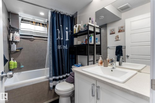 Bathroom with vanity and tiled shower / bath - 9847 79 Street, Edmonton, AB - Indoor Photo Showing Bathroom