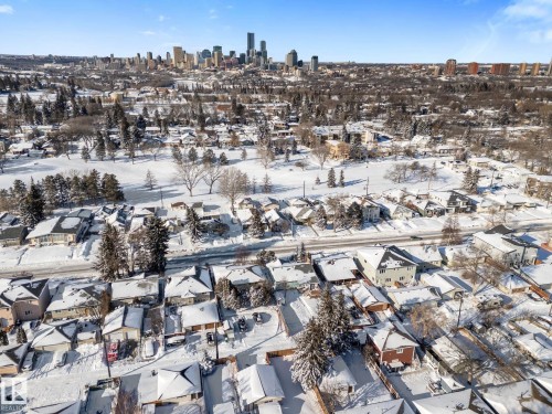 Snowy aerial view featuring a view of skyline - 9847 79 Street, Edmonton, AB - Outdoor With View