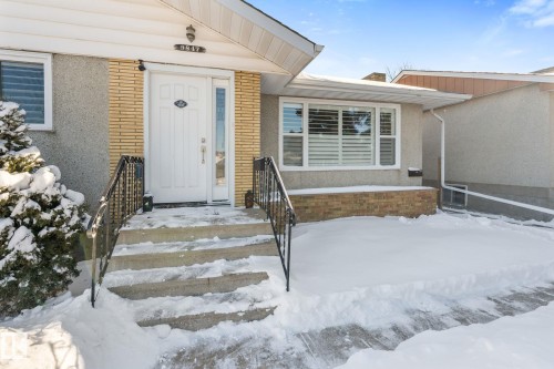 Snow covered property entrance featuring brick siding - 9847 79 Street, Edmonton, AB - Outdoor