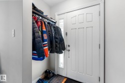 Foyer entrance featuring baseboards - 