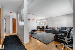Living room with light wood-type flooring - 