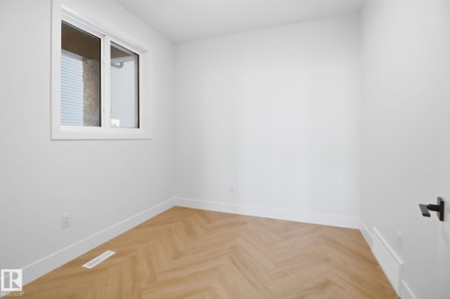 Spare room with parquet floors and baseboards - 90 Eldridge Point(E), St. Albert, AB - Indoor Photo Showing Other Room