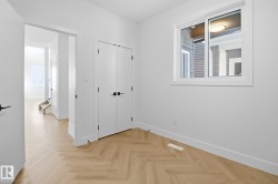 Unfurnished bedroom featuring parquet floors and a closet - 