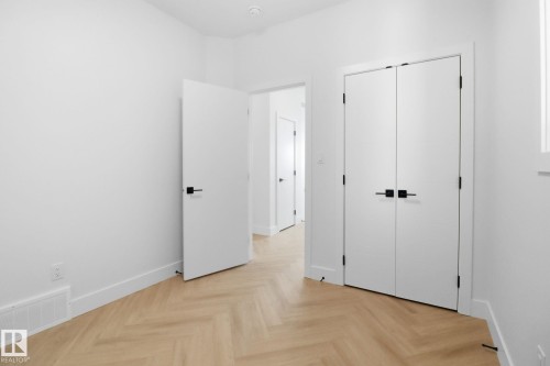 Unfurnished bedroom featuring parquet floors and a closet - 90 Eldridge Point(E), St. Albert, AB - Indoor Photo Showing Other Room