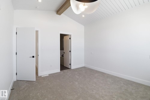 Unfurnished bedroom with light colored carpet, ensuite bath, recessed lighting, and ceiling fan - 90 Eldridge Point(E), St. Albert, AB - Indoor Photo Showing Other Room