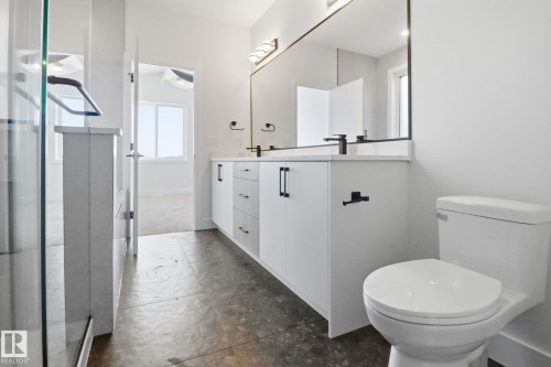 Bathroom featuring toilet and double vanity - 90 Eldridge Point(E), St. Albert, AB - Indoor Photo Showing Bathroom