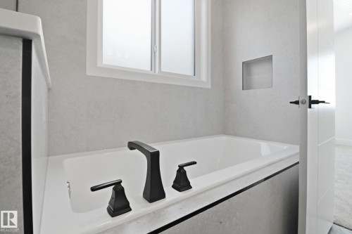 Bathroom with a bath - 90 Eldridge Point(E), St. Albert, AB - Indoor Photo Showing Bathroom