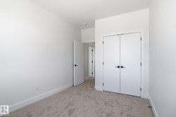 Unfurnished bedroom featuring carpet floors and a closet - 