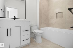 Bathroom with vanity and shower / bath combination - 