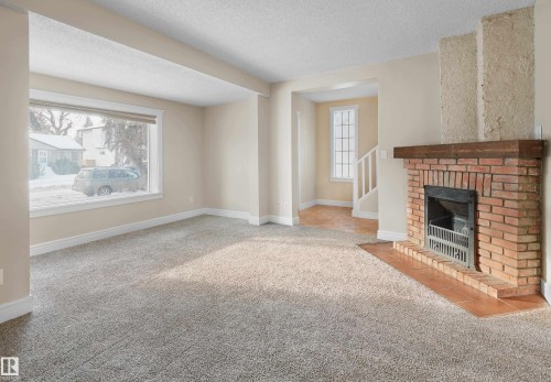 11212 75 Avenue, Edmonton, AB - Indoor Photo Showing Living Room With Fireplace
