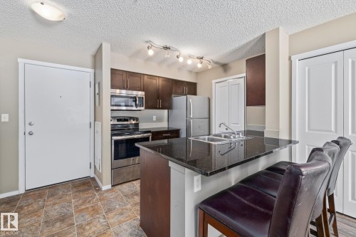 109 5370 Chappelle Road, Edmonton, AB - Indoor Photo Showing Kitchen With Stainless Steel Kitchen With Double Sink