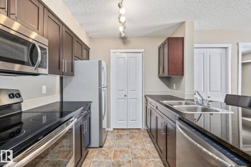109 5370 Chappelle Road, Edmonton, AB - Indoor Photo Showing Kitchen With Stainless Steel Kitchen With Double Sink
