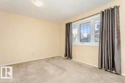 Carpeted spare room with baseboards - 