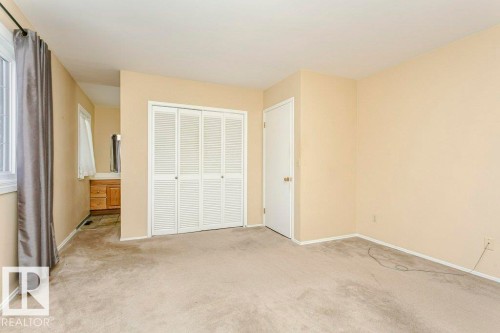 Unfurnished bedroom with light colored carpet and a closet - 6304 131 Street, Edmonton, AB - Indoor Photo Showing Other Room