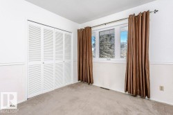 Unfurnished bedroom featuring carpet and a closet - 