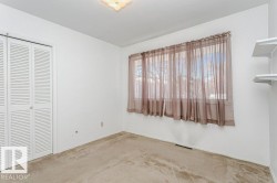 Unfurnished bedroom with carpet flooring and a closet - 