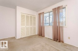 Unfurnished bedroom with carpet floors and a closet - 