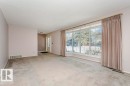 Carpeted spare room with a textured ceiling and baseboards - 6304 131 Street, Edmonton, AB  - Indoor Photo Showing Other Room 