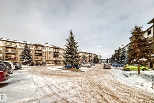 Snow covered building featuring a view of apartment building / complex - 306 1188 Hyndman Road, Edmonton, AB - Outdoor