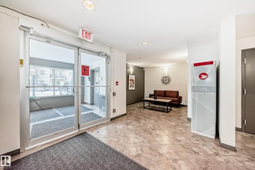 Community lobby with recessed lighting - 306 1188 Hyndman Road, Edmonton, AB - Indoor Photo Showing Other Room