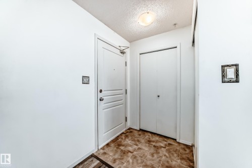 Entryway with a textured ceiling - 306 1188 Hyndman Road, Edmonton, AB - Indoor Photo Showing Other Room