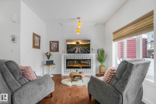 3 450 Mcconachie Way, Edmonton, AB - Indoor Photo Showing Living Room With Fireplace