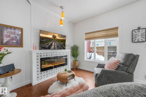 3 450 Mcconachie Way, Edmonton, AB - Indoor Photo Showing Living Room With Fireplace