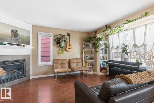 3820 53 Street, Gibbons, AB - Indoor Photo Showing Living Room With Fireplace