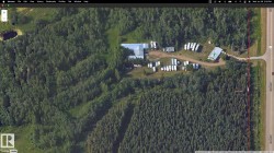 View of property location featuring a forest and property parcel outlined - 