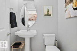 2-piece bathroom on main floor, just outside the flex room and mud room entrance. - 