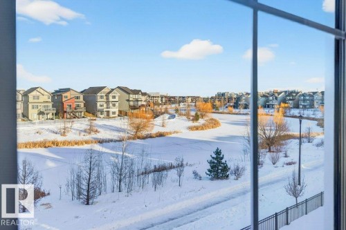 View of pond from owner's suite/primary bedroom. - 1909 Davidson Wynd, Edmonton, AB - Outdoor With View