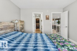 View towards primary bedroom ensuite and hallway. - 