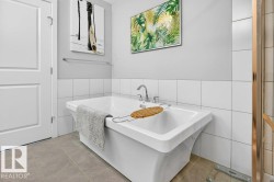 Primary suite ensuite with stand alone tub. - 