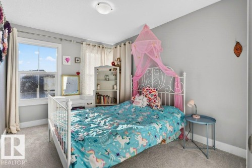 Large south facing bedroom with large closet. - 1909 Davidson Wynd, Edmonton, AB - Indoor Photo Showing Bedroom