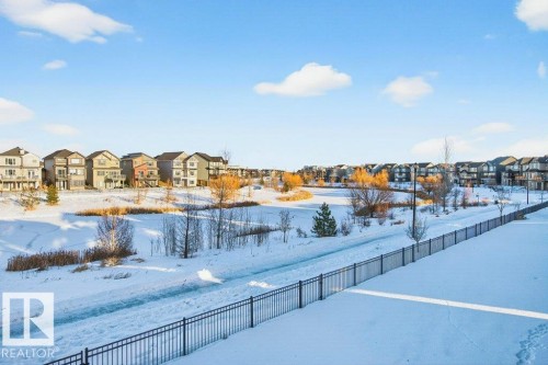 View of walkway and pond behind the home. - 1909 Davidson Wynd, Edmonton, AB - Outdoor With View