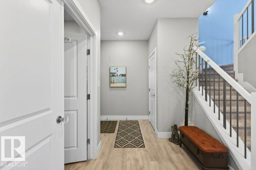 Hallway looking towards front foyer and stairs to second level. - 1909 Davidson Wynd, Edmonton, AB - Indoor Photo Showing Other Room