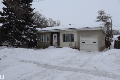 View of front of home featuring a garage - 5109 55 Street, Barrhead, AB - Outdoor